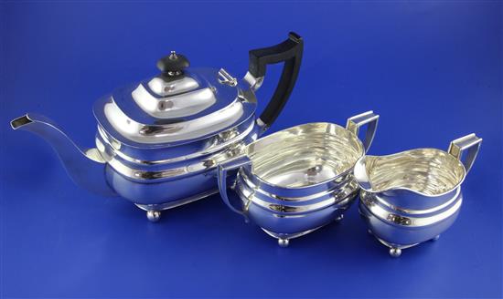 A George VI silver three piece tea set by William Hutton & Sons Ltd, gross 34 oz.